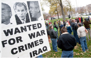 Read more about the article Former U.S. Army Veteran Michael Prysner Confronts ex-President George W. Bush about the Iraq War